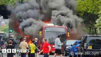Bus bursts into flames on busy street