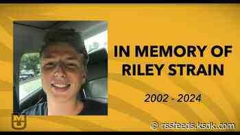 Riley Strain's parents accept his degree at University of Missouri graduation