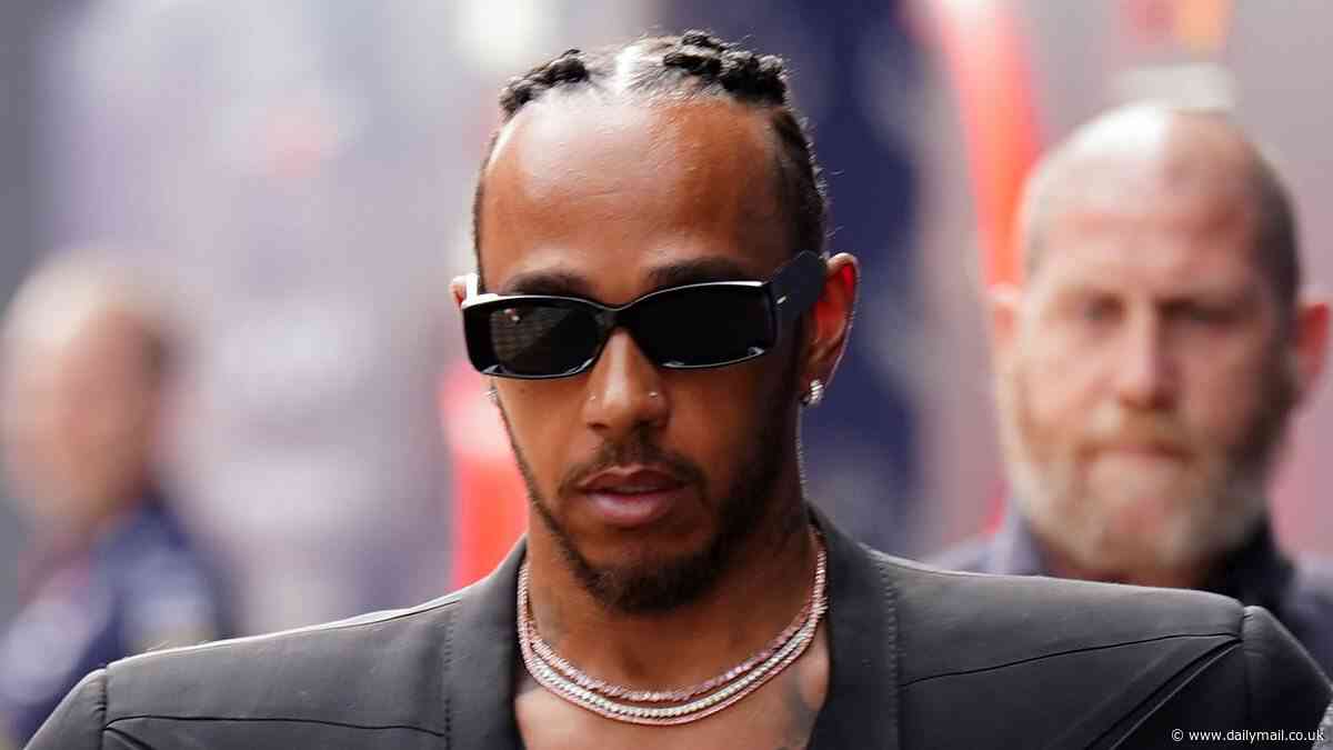 Lewis Hamilton showcases his quirky fashion sense as he walks the paddock at the Italian Grand Prix baring his chest in a flared jumpsuit and shoulder-padded blazer