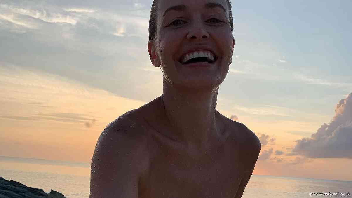 Lara Worthington posts three-year-old thirst trap as she flaunts sensational figure in black swimsuit during holiday in Turks and Caicos Islands
