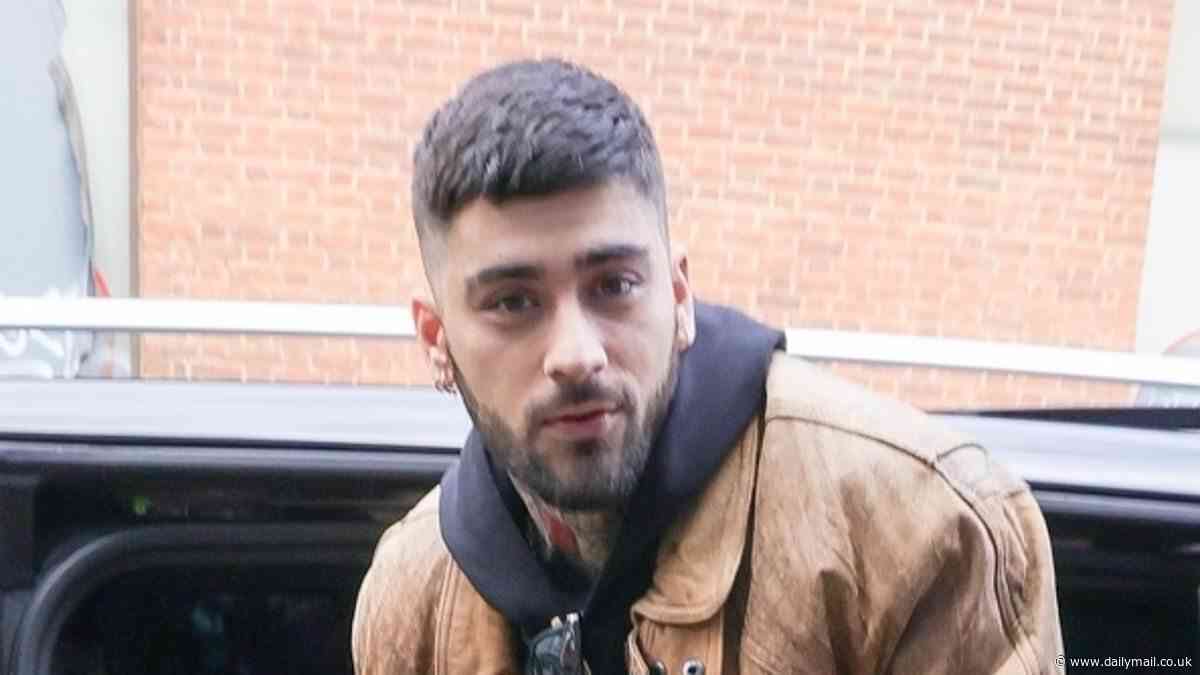 Zayn Malik is greeted by huge crowds lining the streets as he arrives at a meet and greet in London after his first ever solo gig