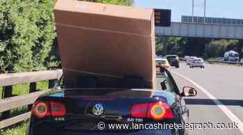 Driver stopped on M60 with 60 inch TV sticking out