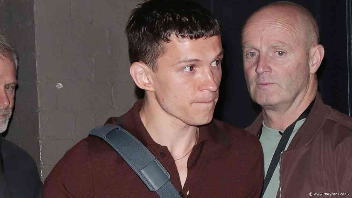 Here comes the char-crossed lover! Tom Holland enjoys a post-show cuppa as he leaves the Duke of York Theatre after latest performance in Romeo And Juliet