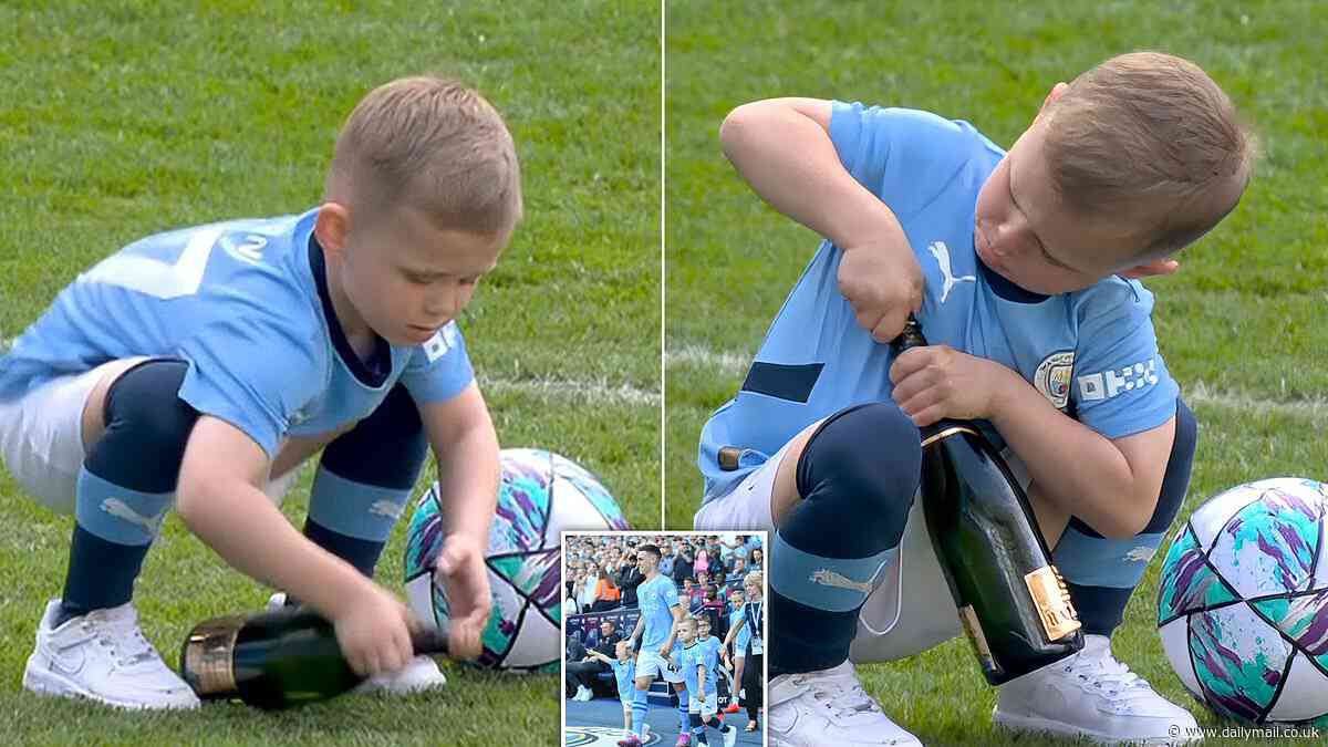 Moment Phil Foden's son Ronnie, five, tries to pop open a champagne bottle to join in the fun after his dad's team Man City wins