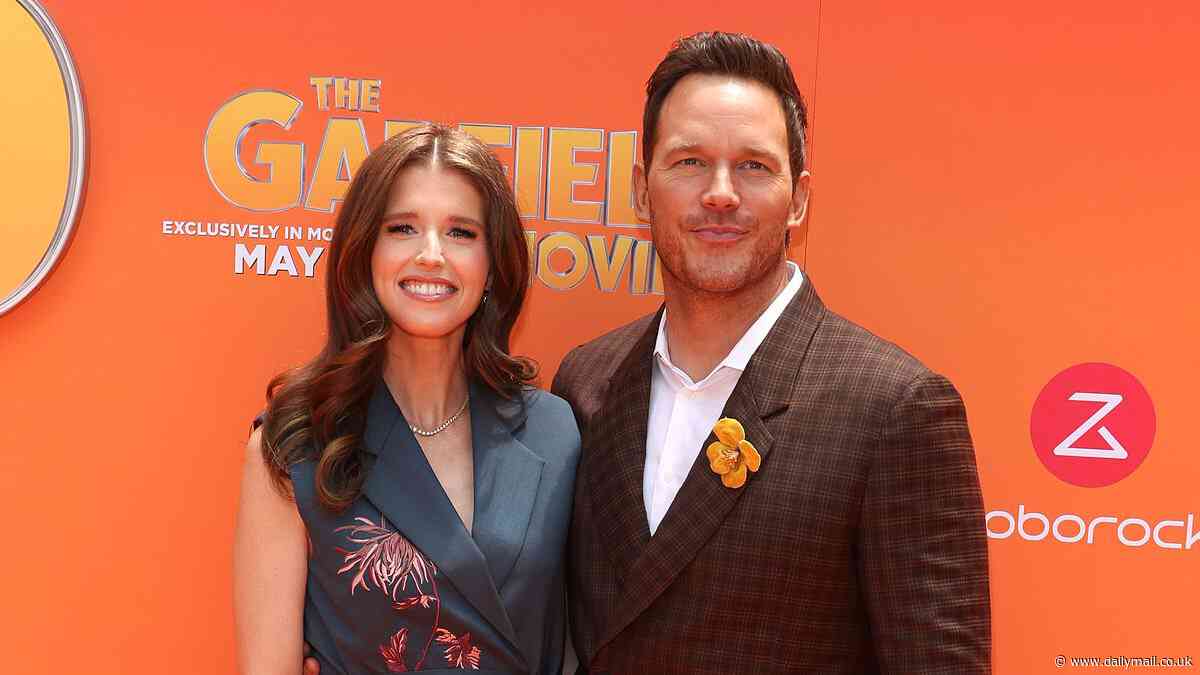 Chris Pratt is supported by wife Katherine Schwarzenegger as they share a giggle while leading star parade at The Garfield Movie premiere in Hollywood