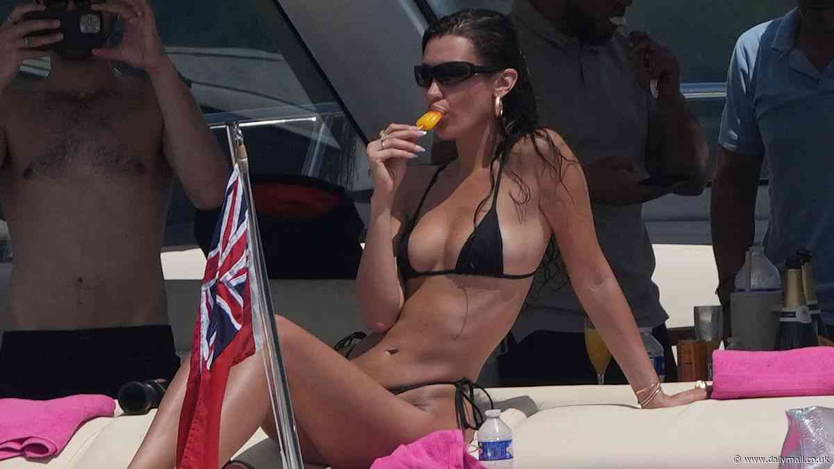 Bella Hadid scintillates as she strips down to tiny black thong bikini while yachting in south of France during break from Cannes Film Festival