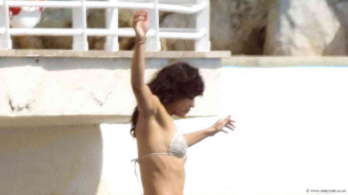 Michelle Rodriguez, 45, strips down to her bikini as she goes swimming at her luxury hotel during the 77th annual Cannes Film Festival