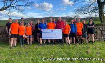 Pendle Trail Runners donate £250 to rescue team