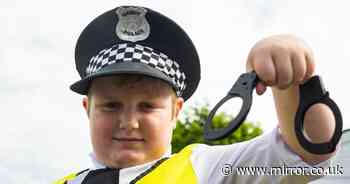 Autistic boy, 6, wears police uniform to help direct traffic and 'keep his town safe'