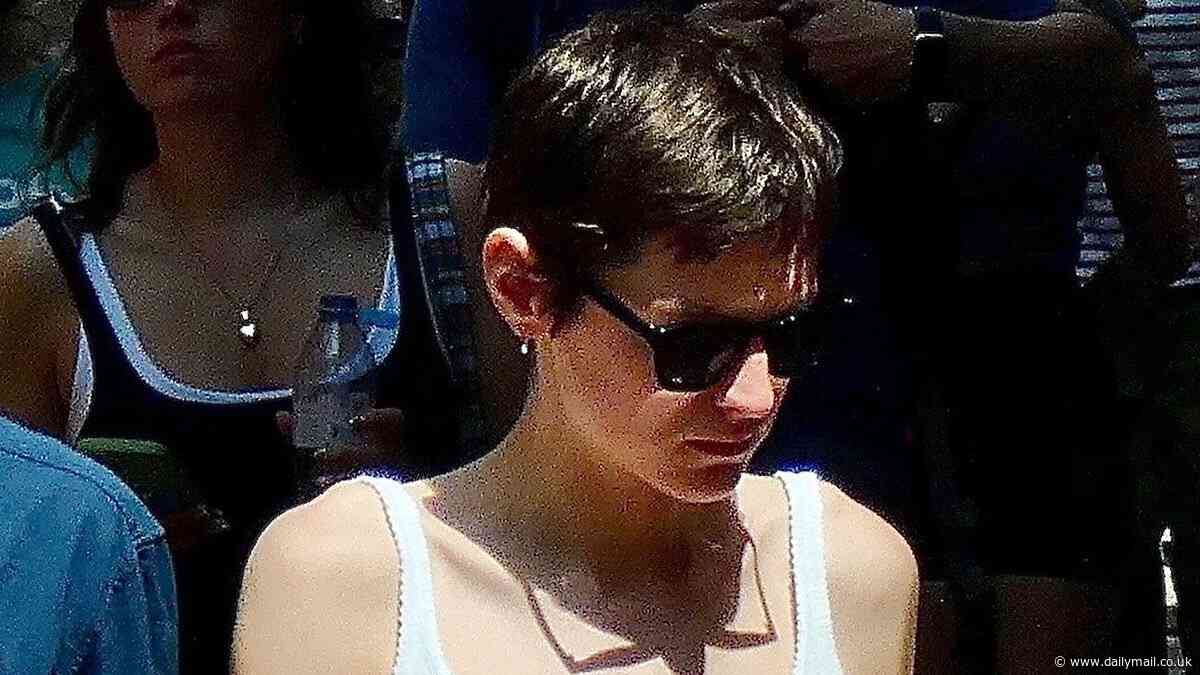 Emma Corrin, 28, cuts a casual figure in a white tank top and slacks on shopping trip with boyfriend Rami Malek, 43, in Hampstead
