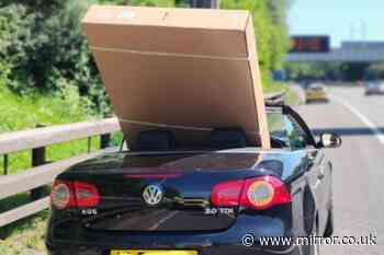 Driver pulled over by police after trying to bring 60-inch TV home in his convertible