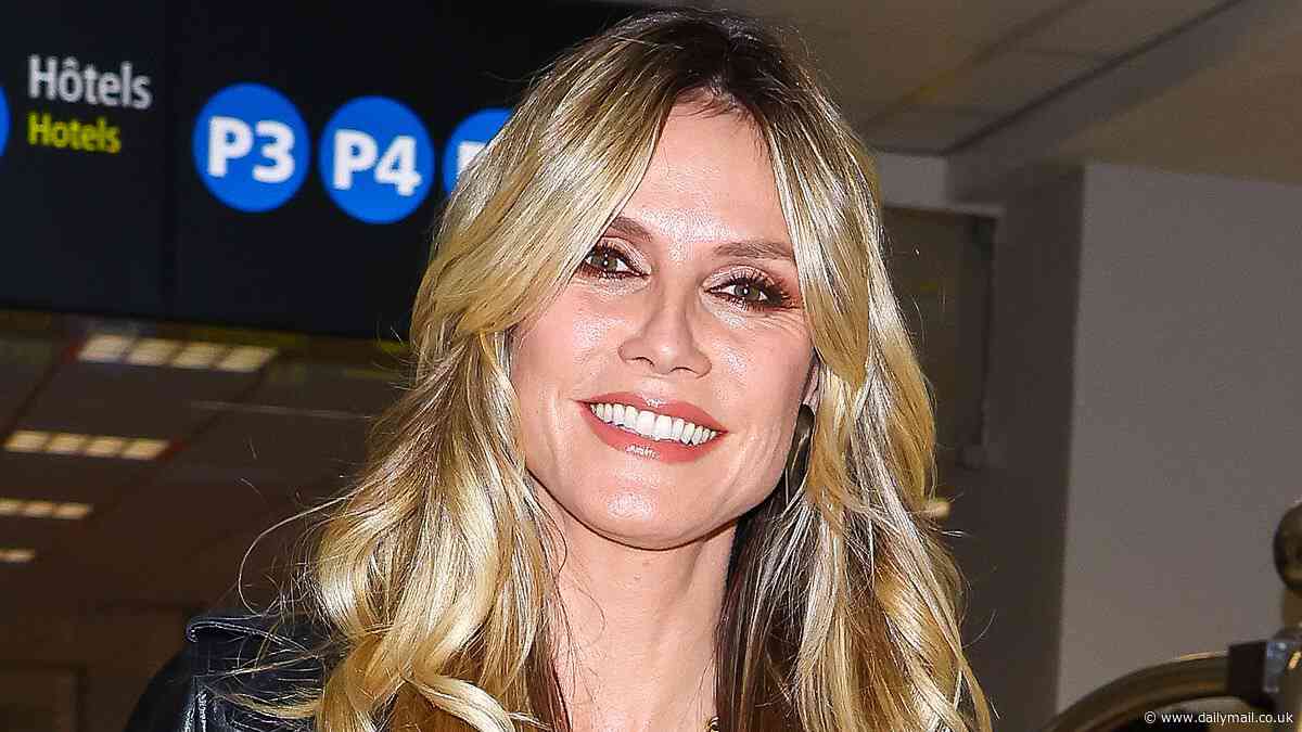 Heidi Klum stuns as she arrives back into Nice airport donning a black satin ensemble and leather jacket for Cannes Film Festival 'round two'