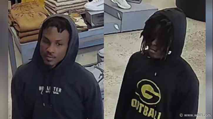 Police searching for two men who broke into car, used owner's credit cards