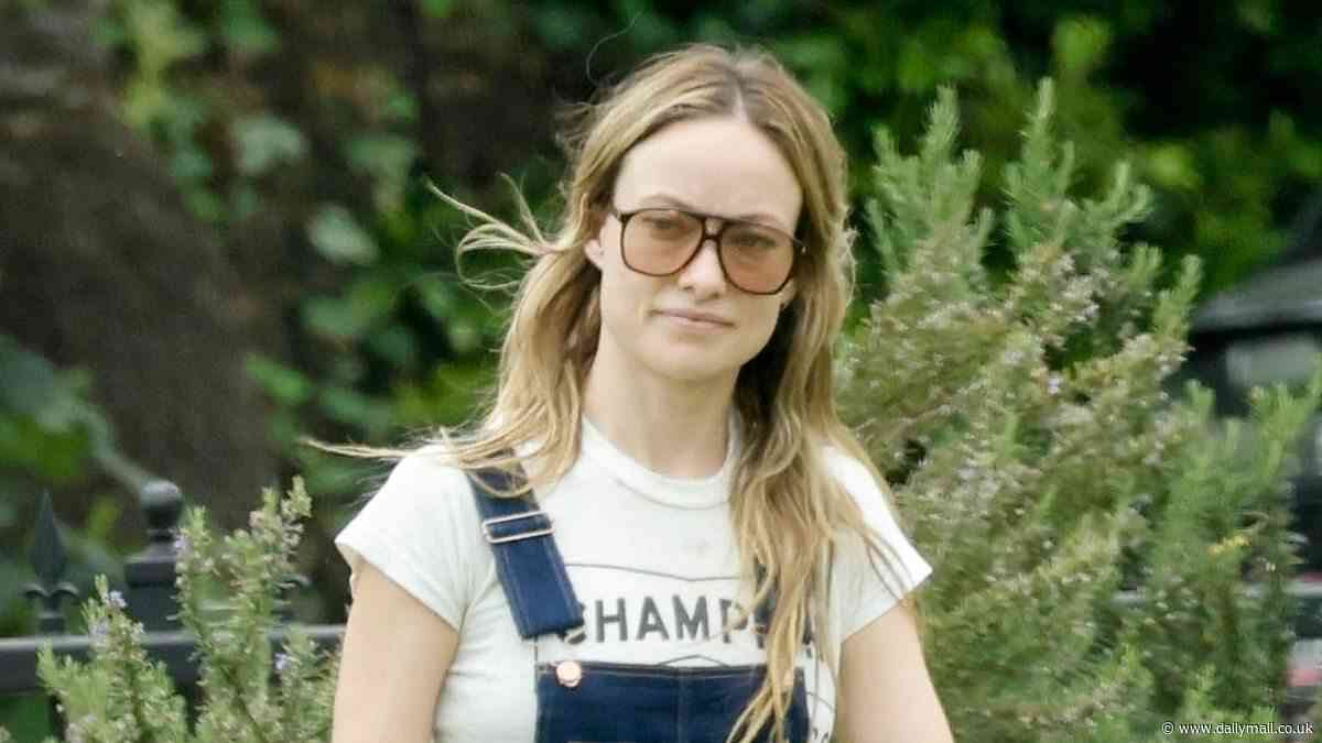 Olivia Wilde is country chic in denim overalls as she shares a sweet hug with her son Otis, 10, while at a park in Los Angeles