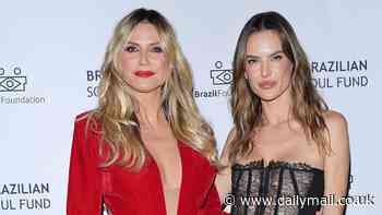 Heidi Klum commands attention in a plunging red velvet mini dress as she joins fellow model Alessandra Ambrosio at charity event in Cannes