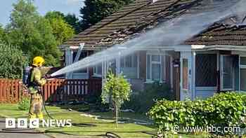 Man treated in hospital after house fire