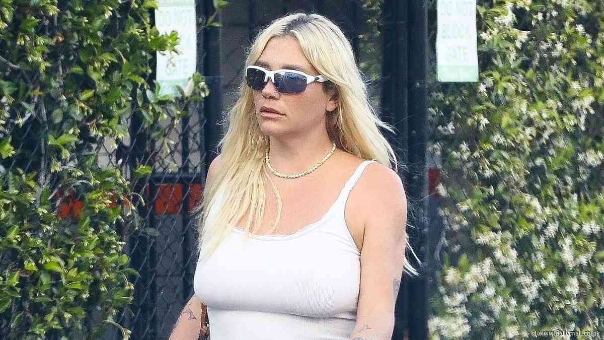 Kesha cuts a casual display in a white crop top as she steps out in Beverly Hills after urging fans to learn new Diddy lyrics in her hit song TiK ToK - amid rapper's sex trafficking probe