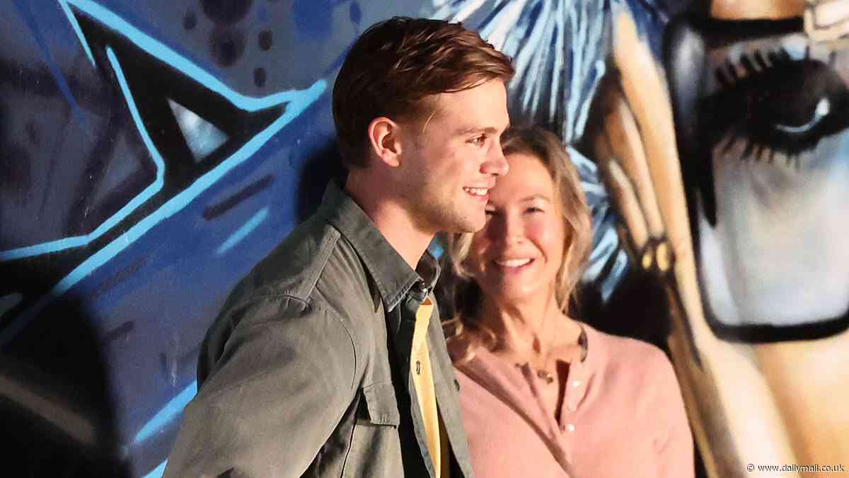 Bridget Jones star Renee Zellwegger, 55, looks giddy on a date with her hunky younger lover played    by Leo Woodall, 27, in Notting Hill as they film scenes for Mad About A Boy