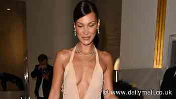 Bella Hadid commands attention in a plunging nude midi dress as she leaves the iconic Hotel Martinez during Cannes Film Festival