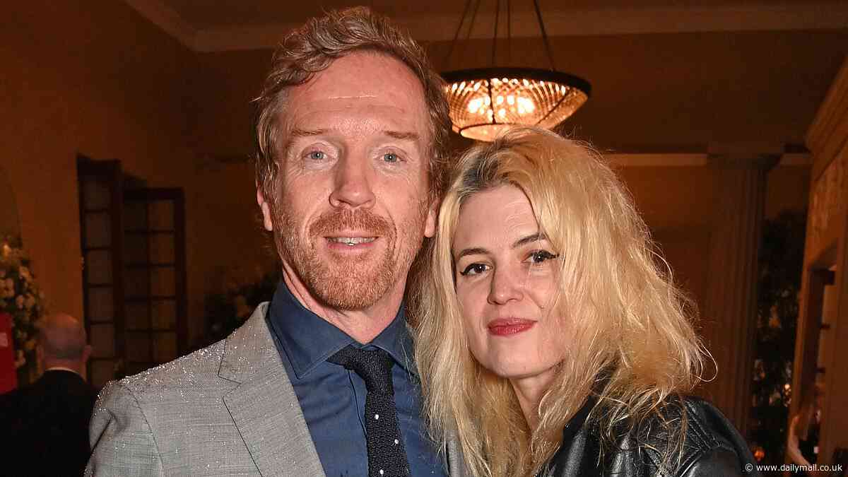 Damian Lewis looks dapper in a grey suit as he cosies up to stylish girlfriend Alison Mosshart at the Prince's Trust Awards