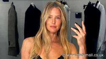 Bar Refaeli puts on a VERY racy display in black lacy underwear as she flaunts her washboard abs