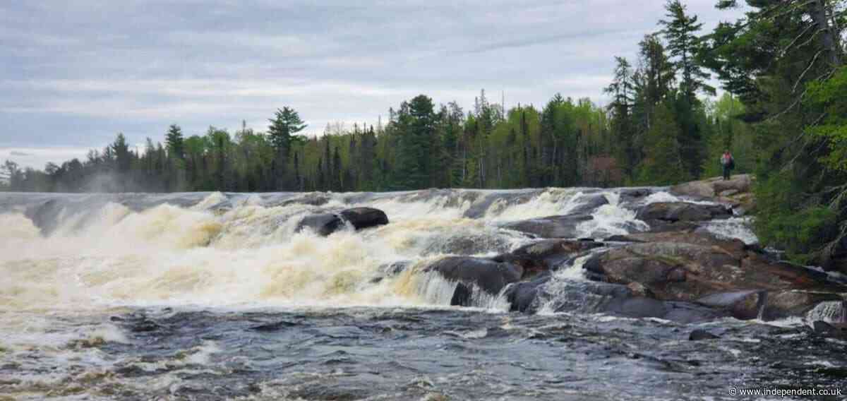 Two missing after canoes go over Minnesota waterfall as harsh weather hinders search