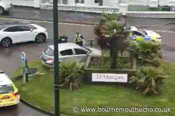 Driver arrested after crashing car into roundabout and fleeing scene