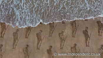 Sand silhouettes on UK beach mark 80th anniversary of D-Day landings