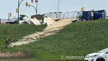 Lumber tumbles down embankment in Saskatoon freeway crash