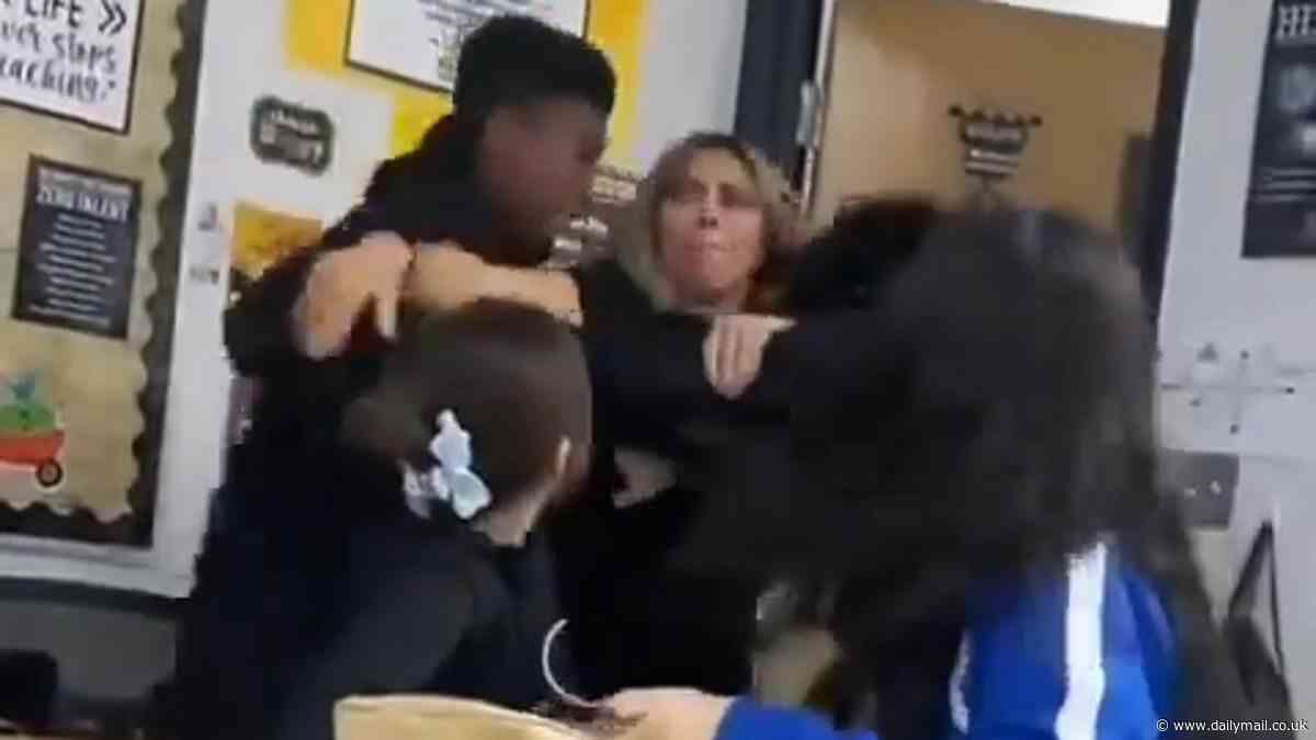 Shocking moment female middle school teacher is hurled to the ground by boy while trying to break up fight between two students