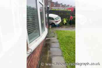 Cherry Tree: Car becomes wedged between house and fence
