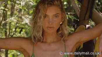 Elsa Hosk, 35, strikes a very suggestive pose after slipping into a shiny green string bikini in the Caribbean... before Cannes appearance