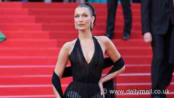 Bella Hadid stuns in a plunging black evening gown at the premiere of L'Amour Ouf during the Cannes Film Festival - hours after showing her support for war-torn Palestine with a Keffiyeh-fashioned dress
