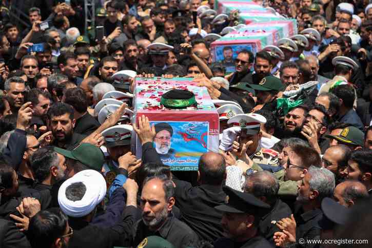 Iran’s late president interred at nation’s holiest Shiite site