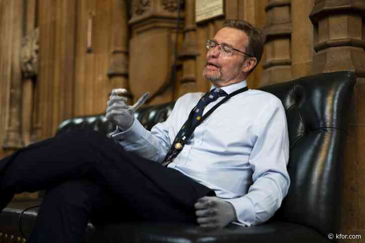 UK lawmaker returns to work as 'the bionic MP' after losing his hands and feet