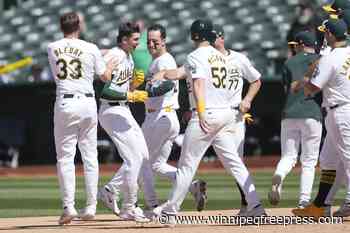 A’s hit 2 tying homers in late innings and score 5 in 11th to rally past Rockies