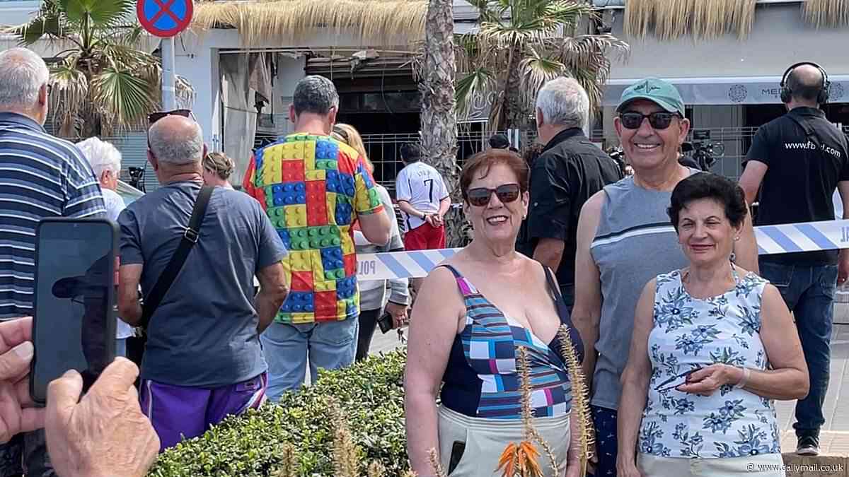 Tourists pose for photos outside Majorca club where four people died in rooftop bar collapse as residents reveal why they fear the tragedy 'will happen again'