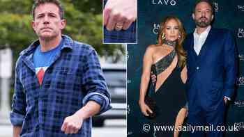 The ring is still on! Ben Affleck flashes band from Jennifer Lopez despite dining on delivery pizza at his $100K-a-month rental while she parties at their $60M mansion