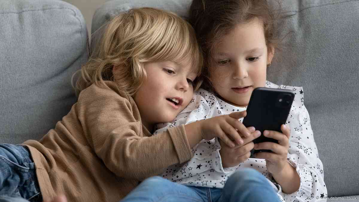 MPs warn under-16s might have to be 'banned' from using mobile phones to stop 'shocking' harm being done to children as figures show one-in-five pre-schoolers own a device