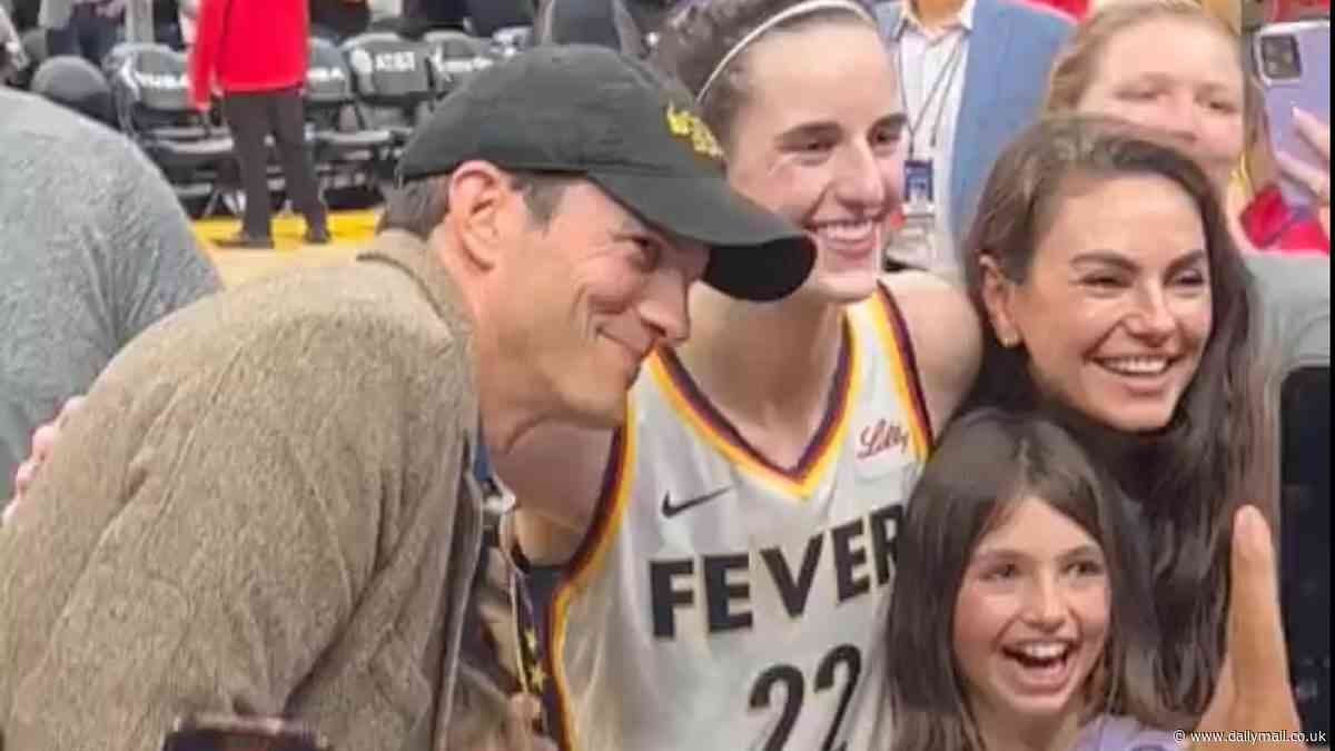 Caitlin Clark celebrates with fellow Iowa Hawkeye Ashton Kutcher and