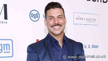 Vanderpump Rules star Jax Taylor is spotted getting close to a mystery woman in an LA bar amid his split from wife Brittany Cartwright