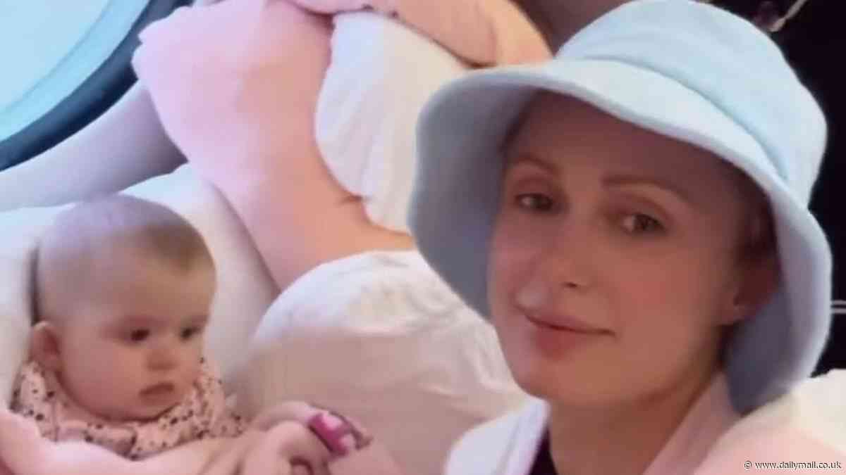 Paris Hilton cuddles up to her two kids in adorable snaps from family vacation to Hawaii... after addressing concerns over their car seats