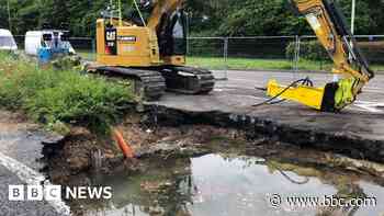 Collapsed road reopens after burst water main