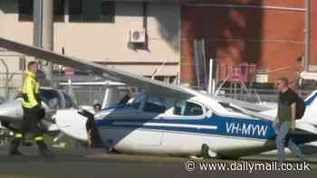 Dramatic moment light plane crashes at Bankstown Airport in Sydney - but the pilot miraculously walked away unscathed
