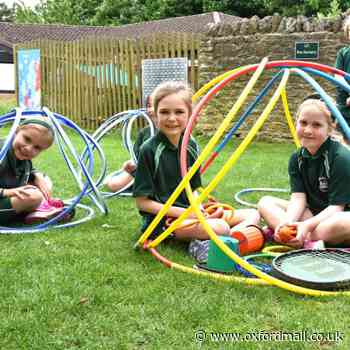 Pupils at prep school enjoy building hoop dens outdoors
