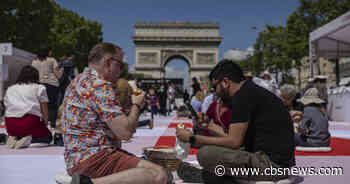 Paris' famous Champs-Elysees turned into a mass picnic