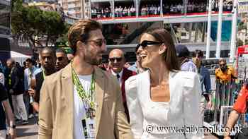 Izabel Goulart and footballer beau Kevin Trap walk hand-in-hand at Monaco Grand Prix amid claims his poor performances on the pitch are because 'she wants sex all the time'