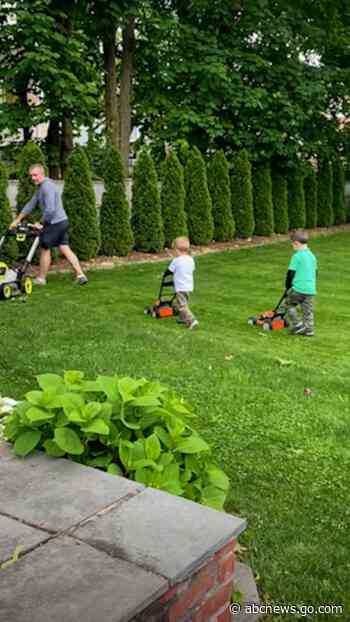 WATCH:  Check out this heartwarming moment of a dad and his sons mowing the lawn