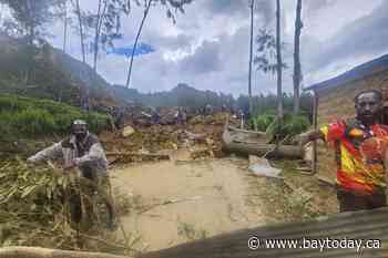 Papua New Guinea government says Friday's landslide buried 2,000 people and formally asks for help