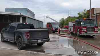 Warehouse burns in Winnipeg industrial area, threatens department store